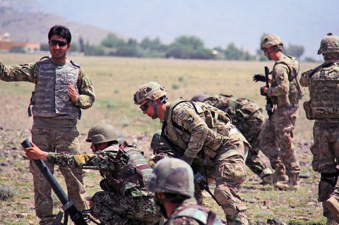 Soldiers with the Afghan National Army’s 2nd Khandak, 1st Brigade, 203rd Corps, prepare to fire 60mm mortars during a live fire exercise as Soldiers with Easy Company, 2nd Battalion, 506th Infantry Regiment, 4th Brigade Combat Team, 101st Airborne Division, observe, in Khowst Province, Afghanistan, June 22, 2013. (Photo by Sgt. Justin A. Moeller, 4th Brigade Combat Team Public Affairs)