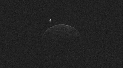 This image of asteroid 1998 QE2 was obtained on June 1, 2013, when the asteroid was about 3.75 million miles (6 million kilometers) from Earth. The small white dot at lower right is the moon, or satellite, orbiting asteroid 1998 QE2. (Image credit: NASA/JPL-Caltech/GSSR)