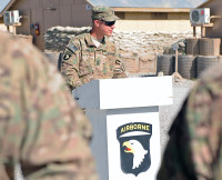 U.S. Army Sgt. 1st Class Gregory Funk, noncomissioned officer in charge, Forward Operating Base Lightning Base Defense Operations Center, 4th Battalion, 320th Field Artillery Regiment, 4th Brigade Combat Team “Currahee”, 101st Airborne Division (Air Assault), conducted a combat patching ceremony for the Currahee Soldiers at Forward Operating Base Lightning June 6th, 2013. (U.S. Army National Guard photo by Spc. Ryan Scott, 129th Mobile Public Affairs Detachment)