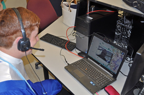 Fort Campbell High School graduate Zachery Toner is all smiles as he talks with his father, 101st Airborne Division Chief of Staff Col. Chris Toner, via Skype as part of the “Operation Yellow Ribbon” program. (Photo by Master Sgt. Pete Mayes)