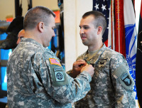 Spc. Jonathan D. Gragert is pinned with an Army Commendation Medal, June 3rd, for winning Soldier of the Year. Gragert, a native of San Jose, CA, was awarded by Brig. Gen. Mark R. Stammer, senior acting commander of the 101st Airborne Division (Air Assault) and Fort Campbell. Gragert, who has been in the military for 13 months, serves with the Soldiers of the 2nd Brigade Combat Team, “Strike,” 101st. (Sgt. David Hodge, 101st Airborne Division)