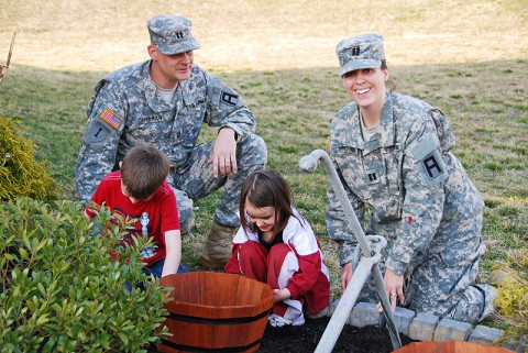 Service members married to other service members, such as Capt. Ron and Capt. Rikki Opperman, are no longer automatically enrolled in the Family Servicemembers' Group Life Insurance program. They must now opt in to the coverage. (Capt. Antonia Greene)