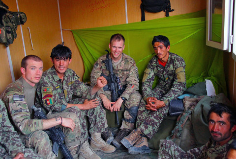 Sgt. Erik Choquette, Security Force Advise and Assist Team medical advisor with the 162nd Infantry Brigade, attached to 2nd Battalion, 506th Infantry Regiment, 4th Brigade Combat Team, 101st Airborne Division, and 1st Lt. James Kromhout, 1st platoon leader for Easy Company, 2nd Bn, 506th Inf. Reg., 4th BCT, 101st Abn. Div., hang out with Afghan National Army Soldiers in their living quarters during a visit to an ANA combat outpost outside of Shur Kalay, Afghanistan, on May 25, 2013. (U.S. Army photo by Sgt. Justin Moeller, 4th Brigade Combat Team Public Affairs)