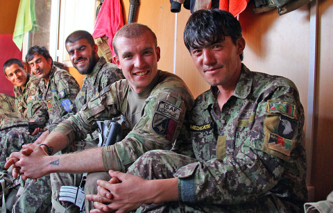 Sgt. Erik Choquette, Security Force Advise and Assist Team medical advisor with the 162nd Infantry Brigade, attached to 2nd Battalion, 506th Infantry Regiment, 4th Brigade Combat Team, 101st Airborne Division, hangs out with Afghan National Army Soldiers in their living quarters during a visit to an ANA combat outpost outside of Shur Kalay, Afghanistan, on May 25, 2013. (U.S. Army photo by Sgt. Justin Moeller, 4th Brigade Combat Team Public Affairs) Sgt. Erik Choquette, Security Force Advise and Assist Team medical advisor with the 162nd Infantry Brigade, attached to 2nd Battalion, 506th Infantry Regiment, 4th Brigade Combat Team, 101st Airborne Division, hangs out with Afghan National Army Soldiers in their living quarters during a visit to an ANA combat outpost outside of Shur Kalay, Afghanistan, on May 25, 2013. (U.S. Army photo by Sgt. Justin Moeller, 4th Brigade Combat Team Public Affairs)