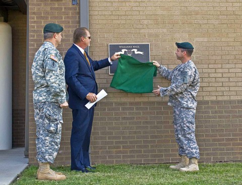 Col. Scott Brower, commander of the 5th Special Forces Group (Airborne), and Lt. Col. Andrew Hanson, commander of 1st Battalion, 5th SFG (A), join Bartley Williams, son of Maj. Charles Q. Williams, a Medal of Honor recipient and former member of the 5th SFG, in unveiling a plaque June 5, during a ceremony naming the battalion’s operations complex as Williams Hall. (Photo by Staff Sgt. Barbara Ospina) Col. Scott Brower, commander of the 5th Special Forces Group (Airborne), and Lt. Col. Andrew Hanson, commander of 1st Battalion, 5th SFG (A), join Bartley Williams, son of Maj. Charles Q. Williams, a Medal of Honor recipient and former member of the 5th SFG, in unveiling a plaque June 5, during a ceremony naming the battalion’s operations complex as Williams Hall. (Photo by Staff Sgt. Barbara Ospina)
