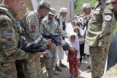 A local Afghan schoolgirl smiles after she receives school supplies from Afghan Border Police and 2nd Brigade Afghan National Civil Order Police soldiers during a community outreach mission, May 25, 2013, in Jalalabad, Nangarhar Province, Afghanistan. (U.S. Army photo by Sgt. Jon Heinrich, CT 1-101 Public Affairs)