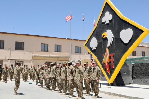 Commander of Task Force Lifeliner, Col. Charles R. Hamilton, raises his right hand as the reenlistment officer and recites the oath of enlistment while the Task Force Lifeliner Soldiers stand before him with their right hand up and repeat the oath to him, July 4, 2013 at Bagram Airfield in Parwan province, Afghanistan. This is the first reenlistment TF Lifeliner has conducted since arriving down range. (Sgt. Sinthia Rosario/U.S. Army)
