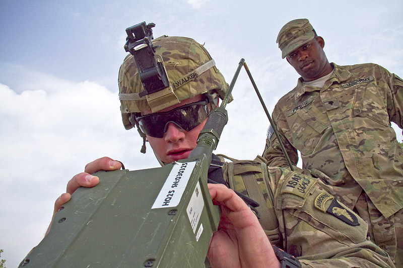 U.S. Army Spc. Christian Walker, a cavalry scout with 1st Squadron, 61st Cavalry Regiment, 4th Brigade Combat Team "Currahee", 101st Airborne Division (Air Assault), participating in the Soldier of the Quarter contest, puts a Single Channel Ground and Airborne Radio System, Advanced System Improvement Program, radio into operation at forward operating base Salerno, Afghanistan, July 14, 2013. (U.S. Army photo by Sgt. Justin A. Moeller, 4th Brigade Combat Team Public Affairs)