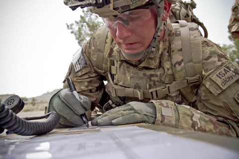 U.S. Army Sgt. Alexander Cerney, an infantryman with 4th Brigade Special Troops Battalion, 4th Brigade Combat Team "Currahee", 101st Airborne Division (Air Assault), participating in the Noncommissioned Officer of the Quarter contest, writes down information for a 9-line medical evacuation at forward operating base Salerno, Afghanistan, July 14, 2013. (U.S. Army photo by Sgt. Justin A. Moeller, 4th Brigade Combat Team Public Affairs)