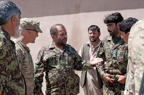 Afghan National Army soldiers sit in the shade at former Combat Outpost Honaker-Miracle, Kunar Province, Afghanistan, July 4, 2013. U.S. Army Soldiers with Security Forces Advisory and Assistance Team 6, 1st Brigade Combat Team, 101st Airborne Division, have been conducting level-two advisory missions at Honaker-Miracle to help the ANA stationed there take a more dominant role in the region. (U.S. Army photo by Sgt. Margaret Taylor, 129th Mobile Public Affairs Detachment)