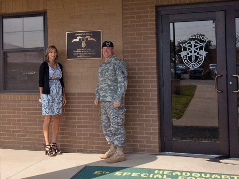 Colonel Scott Brower, commander of the 5th Special Forces Group (Airborne), is joined by Mrs. Melissa Gentsch, daughter of retired Army Col. Robert Howard, following the dedication of the 5th SFG (A) headquarters building in honor of Col. Howard July 3rd, 2013, at Fort Campbell, KY. (Photo courtesy of Staff Sgt. Barbara Ospina)