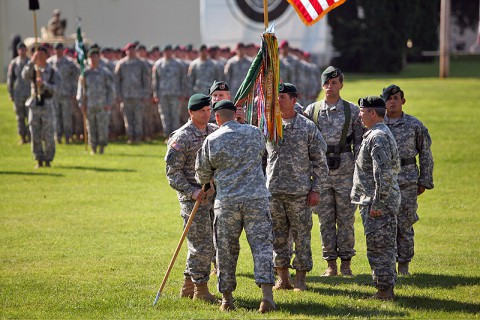 Col. John Brennan accepts the 5th Special Forces Group (Airborne) Colors from Brig. Gen. Christopher Haas, commander of the U.S. Army Special Forces Command, as he assumes command from Col. Scott Brower during a ceremony at Fort Campbell, KY, July 12th, 2013. (Photo courtesy of Spec. Seth Plagenza) 