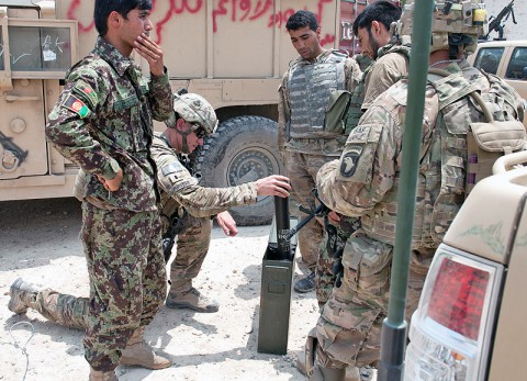 A U.S. Army Soldier with Security Forces Advisory and Assistance Team Blackhorse, 1st Battalion, 327th Infantry Regiment, 1st Brigade Combat Team, 101st Airborne Division, examines a container of mortar rounds at former Forward Operating Base Connolly, Nangarhar Province, Afghanistan, July 7, 2013.  (U.S. Army photo by Sgt. Margaret Taylor, 129th Mobile Public Affairs Detachment)