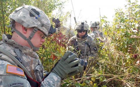 Staff Sgt. James P. Hunter views his photos while following other Soldiers of 2nd Brigade Combat Team, 101st Airborne Division, during a field training exercise. Hunter's face was rarely in front of the camera, as his job as an Army journalist was to record the lives of Soldiers " whether they were training at Fort Campbell or patrolling the streets of Afghanistan. Hunter died while deployed with Strike in Afghanistan, June 18th, 2010. (Fort Campbell Courier archive)