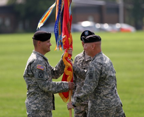 Col. Edward O’Neill, commander of the 108th Air Defense Artillery Brigade, passes the battalion colors to Lt. Col. Timothy Shaffer, incoming commander of the 2nd Battalion, 44th Air Defense Artillery Regiment. (Sgt. Leejay Lockhart/U.S. Army)