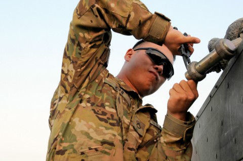 Pfc. Hanook M. Chi a native of Seoul, South Korea and a parachute rigger with Task Force Lifeliner, adds missing spacer to the clevis on sling legs during sling load operations Aug. 8, 2013, at Bagram Air Field, Parwan province, Afghanistan. Task Force Lifeliner covers sling load operations for Regional Commands East, North and Capital. (U.S. Army photo by Sgt. Sinthia Rosario, Task Force Lifeliner Public Affairs)