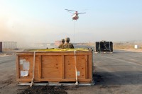 Spc. Vonza Abney a native of Hinesville, Ga., and Pfc. Hanook M. Chi a native of Seoul, South Korea, both parachute riggers with Task Force Lifeliner, observe contracting aircraft as it approaches to pick up cargo during sling load operations to supply to one of the Forward Operating Bases Aug. 8, 2013, at Bagram Air Field, Parwan province, Afghanistan. Task Force Lifeliner covers sling load operations for Regional Command’s East, North and Capital. www.facebook.com/lifeliner (Sgt. Sinthia Rosario/U.S. Army)