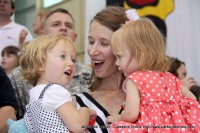 A mother and daughter sings the army song together