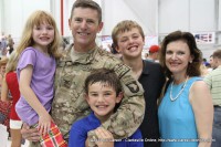 The 1st Brigade Combat Team Commander Col. Joseph P. McGee with his family