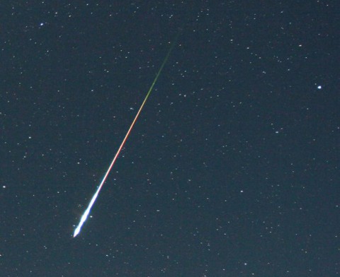 Larger meteoroids cause bright flashes of light when they hit Earth's atmosphere, such as this fireball caught during the Perseid meteor shower Aug. 12, 2006. The bulk of meteoric activity is much less showy: Some 10 to 40 tons of meteor dust enter our atmosphere every day. (Image Credit: Courtesy of Pierre Martin) Larger meteoroids cause bright flashes of light when they hit Earth's atmosphere, such as this fireball caught during the Perseid meteor shower Aug. 12, 2006. The bulk of meteoric activity is much less showy: Some 10 to 40 tons of meteor dust enter our atmosphere every day. (Image Credit: Courtesy of Pierre Martin)