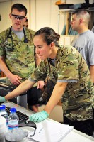 U.S. Army Spc. Megan Dalton, radiology specialist with Company C, 801st Brigade Support Battalion, 4th Brigade Combat Team “Currahee,” 101st Airborne Division (Air Assault), checks a computer screen at the Combat Support Hospital on Forward Operating Base Salerno, Afghanistan, July 14, 2013. (U.S. Army photo by Maj. Kamil Sztalkoper, 4th Brigade Combat Team Public Affairs)