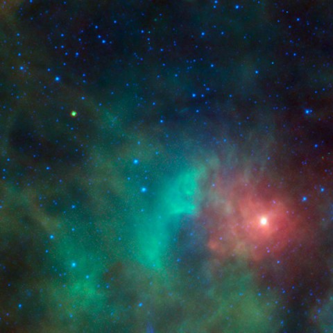 This image shows the potentially hazardous near-Earth object 1998 KN3 as it zips past a cloud of dense gas and dust near the Orion nebula. NEOWISE, the asteroid-hunting portion of the Wide-field Infrared Survey Explorer, or WISE, mission, snapped infrared pictures of the asteroid, seen as the yellow-green dot at upper left. Because asteroids are warmed by the sun to roughly room temperature, they glow brightly at the infrared wavelengths used by WISE. (Image credit: NASA/JPL-Caltech)