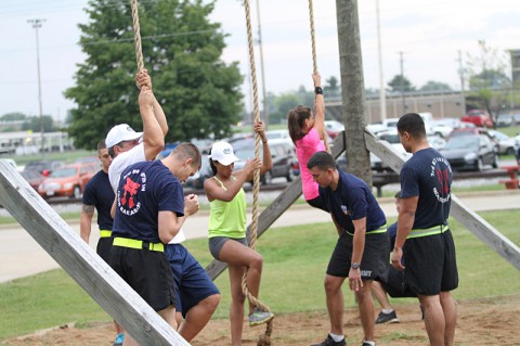 Soldiers assigned to Company C, 3rd Battalion, 187th Infantry Regiment, 3rd Brigade Combat Team “Rakkasans,” 101st Airborne Division (Air Assault), assist members of the Fox Sports 1 team with the proper rope climbing technique during their physical fitness session at Fort Campbell, Ky., Aug. 12, 2013. (U.S. Army Spc. Brian Smith-Dutton 3BCT Public Affairs)