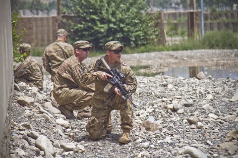 Soldiers with India Company, 2nd Battalion, 506th Infantry Regiment, 4th Brigade Combat Team, 101st Airborne Division (Air Assault), show members of the Afghan Uniformed Police on how to pull security during a tactical training class Aug. 15, 2013 at Forward Operating Base Salerno, Afghanistan. (U.S. Army photo by Sgt. Justin A. Moeller, 4th Brigade Combat Team Public Affairs)