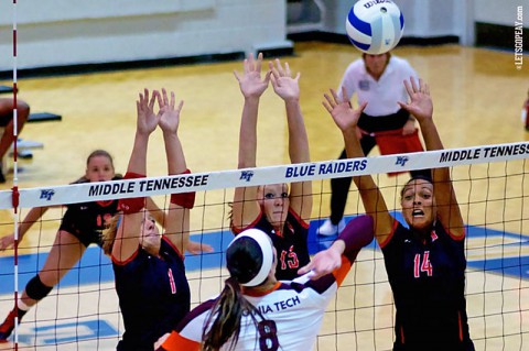 Austin Peay's Cami Fields, Hillary Plybon and Jada Stotts go up for a block against Virginia Tech's Samantha Gostling, Friday, in the opening match of the MT Invitational. (APSU Sports Information)