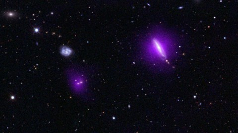 An optical color image of galaxies is seen here overlaid with X-ray data (magenta) from NASA's Nuclear Spectroscopic Telescope Array (NuSTAR). (Image credit: NASA/JPL-Caltech)