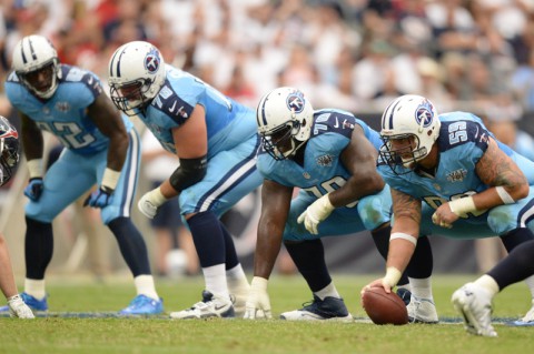 Tennessee Titans center Robert Turner (59) snaps the ball against the Houston Texans during the first half at Reliant Stadium(Thomas Campbell-USA TODAY Sports)