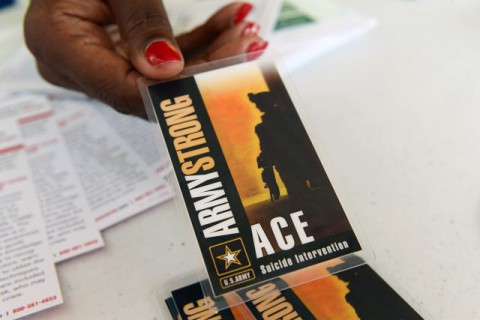 Members of the Army Suicide Prevention Program provide information about the resources available for Soldiers, Army civilians and family members, Sept. 12, 2013. Seen here is the Army ACE card that highlights the importance of three steps: asking if a person is suicidal, caring for that person and escorting that person to a professional.