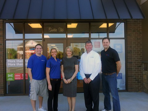 Pictured from left to right: Matt McColbey, graphic designer; Samantha Serum, visual communications specialist; Catherine Monson, CEO of FASTSIGNS International, Inc.; Lincoln Barnard, owner; Denny Fry, marketing and media manager.