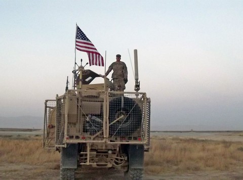 Sgt. Jeffery A. Carter, Sr., a native of Vienna, GA, stands on top of his vehicle at Forward Operating Base Kunduz in October 2013. Soldiers from the 1230th Transportation Company, a National Guard Unit out of Thomasville, GA, supported the 524th Combat Sustainment Support Battalion, made one last retrograde run to Kunduz to pick up the last items to be retrograded prior to transferring the base to Afghanistan’s security forces. (524th Combat Sustainment Support Battalion) Sgt. Jeffery A. Carter, Sr., a native of Vienna, GA, stands on top of his vehicle at Forward Operating Base Kunduz in October 2013. Soldiers from the 1230th Transportation Company, a National Guard Unit out of Thomasville, GA, supported the 524th Combat Sustainment Support Battalion, made one last retrograde run to Kunduz to pick up the last items to be retrograded prior to transferring the base to Afghanistan’s security forces. (524th Combat Sustainment Support Battalion)