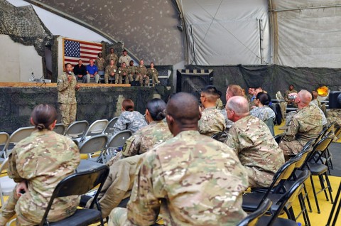 Task Force Lifeliner commander Col. Charles R. Hamilton, a native of Chantilly, Va., speaks to postal service members and civilians during the 2013 Theater Postal Conference hosted by Task Force Lifeliner, Oct. 19, 2013, at Bagram Air Field, Parwan province, Afghanistan. This conference gives the postal workers the opportunity to address postal operations, finances, planning or issues that can affect daily operations. (Sgt. Sinthia Rosario, Task Force Lifeliner Public Affairs)