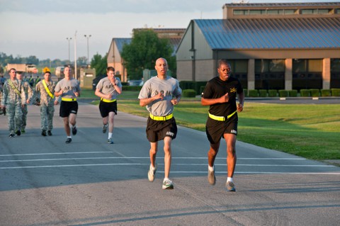 Sgt. Reginald Banks, Headquarters and Headquarters Company, 5th Battalion, 101st Combat Aviation Brigade, 101st Airborne Division (Air Assault,) temporary duty noncommissioned officer paces Sgt. 1st Class Jimmie Jones, F Company, 2nd Squadron, 17th Cavalry Regiment, platoon sergeant during the running event of the Army physical fitness test held near 101st CAB headquarters at Fort Campbell, Ky., Oct. 9, 2013. (U.S. Army photo by Sgt. Duncan Brennan, 101st CAB Public Affairs)