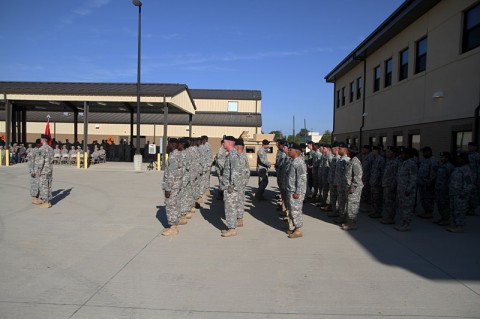 Soldiers with the 326th Engineer Battalion wait in formation for their company leadership to “patch” their left sleeves during the unit’s patch changing ceremony Oct. 18 at the battalion headquarters here. (Sgt. 1st Class John Brown)