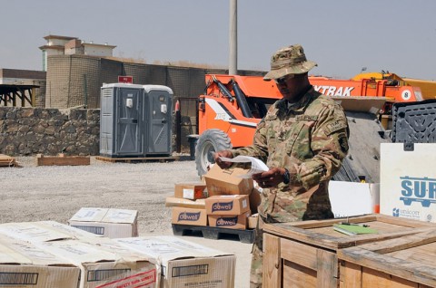 Sgt. 1st Class Charles A. Davis, a native of Birmingham, AL, and an accountable officer, verifies the material release order form for a package received at the Supply Storage Activity warehouse, Sept. 17, 2013, at Forward Operating Base Phoenix in Kabul, Afghanistan. This process is to ensure the equipment and quantity matches the MRO. (Sgt. Sinthia Rosario, Task Force Lifeliner Public Affairs)