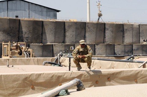 Pfc. Dewayne M. Johnson, a native of Muncie, Ind., and fuel noncommissioned officer with the 1438th Transportation Company in support of Task Force Lifeliner, conducts a visual inspection of a fuel distribution point during their monthly fuel audit, Sept. 17, 2013, at Forward Operating Base Phoenix in Kabul, Afghanistan. The purpose of this audit is to ensure gain and losses are being tracked. www.facebook.com/lifeliner (Sgt. Sinthia Rosario, Task Force Lifeliner Public Affairs)