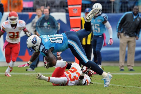 Tennessee Titans tight end Delanie Walker (82) leaps for yardage against Kansas City Chiefs free safety Kendrick Lewis (23) during the second half at LP Field. Kansas City won 26-17 on October 6th, 2013. (Jim Brown-USA TODAY Sports)