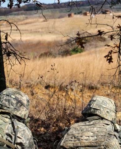 Pvt. Juan Perez and Spc. Anthony Teeters, both infantryman assigned to Troop C, 1st Squadron, 33rd Cavalry Regiment, 3rd Brigade Combat Team "Rakkasans," 101st Airborne Division (Air Assault), stand ready to open fire on targets with their M4 Rifle and M249 Light Machine Gun at a live fire range on Fort Knox, Ky., (Sgt. Brian Smith-Dutton/U.S. Army)