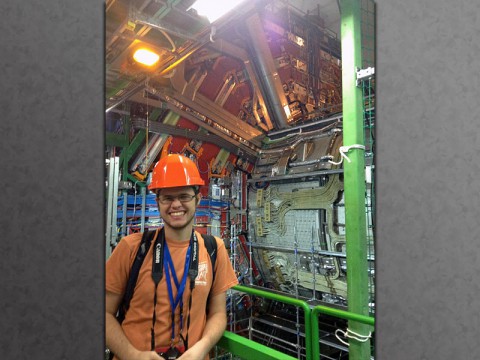 APSU student Chris Hayes stands next to the CMS detector, which is part of the Large Hadron Collider at CERN in Switzerland. 