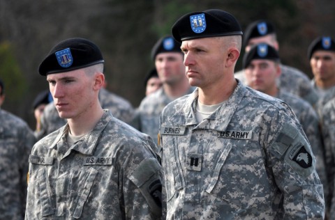 Capt. Jason Burnes, an assistant operations officer at Headquarters and Headquarters Company, 3rd Special Troops Battalion, 3rd Brigade Combat Team “Rakkasan”, 101st Airborne Division (Air Assault) and Pvt. Robert C. Wall, a rifleman from Company A, 1st Battalion, 187th Infantry Regiment, 3rd Brigade Combat Team, 101st Airborne Division (Air Assault) stand in front of the graduating class Nov. 22, 2013 to be recognized for their achievements.  Burnes set the unofficial record for the 12-mile foot march, a culminating event at the The Sabalauski Air Assault School.  Wall was the class honor graduate.    (Capt. Charlie Emmons/U.S. Army)
