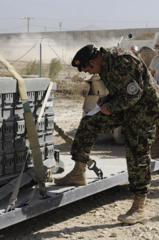 Afghan Maj. Raheem Shama, commander of the Afghan National Army Ammunition Depot (22 Bunkers), inventories small arms ammunition at Bagram Air Field, Parwan province, Afghanistan on Aug. 26, 2013. (U.S. Army photo by Sgt. Sinthia Rosario)