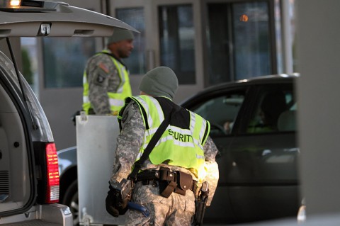 Spc. Bryan Clark, an infantryman from 1st Battalion, 187th Infantry Regiment, 3rd Brigade, 101st Airborne Division (Air Assault), inspects the trunk of a vehicle Dec. 12, at gate 4 on Fort Campbell. Soldiers at the gates keep Fort Campbell safe by vigilantly looking in the vehicles coming onto post for anything that poses a threat to the installation or its residents. (U.S. Army photo by Sgt. Leejay Lockhart, 101st Sustainment Brigade Public Affairs)