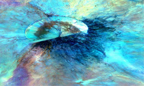 This colorized composite image from NASA's Dawn mission shows the crater Antonia, which lies in the enormous Rheasilvia basin in the southern hemisphere of the giant asteroid Vesta. The area lies around 58 degrees south latitude. Antonia has a diameter of 11 miles (17 kilometers). (NASA/JPL-Caltech/UCLAMPS/DLR/IDA)