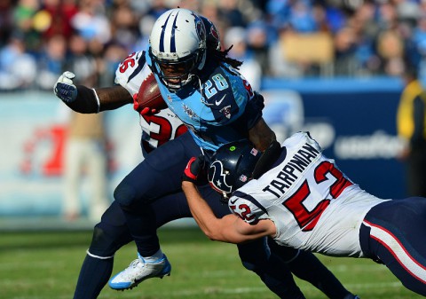 Tennessee Titans running back Chris Johnson (28) carries the ball as Houston Texans linebacker Jeff Tarpinian (52) tackles during the second half at LP Field. The Titans won 16-10. (Don McPeak-USA TODAY Sports)