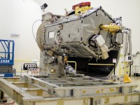 NASA's Orbiting Carbon Observatory (OCO)-2 spacecraft sits "on its back" atop ground support equipment at Orbital Sciences Corporation's Satellite Manufacturing Facility in Gilbert, Ariz., in preparation for environmental testing. The observatory's solar array panels were removed prior to the test. (Orbital Sciences Corporation/NASA/JPL-Caltech)