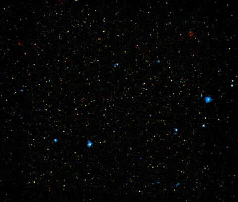 A range of supermassive black holes lights up this new image from NASA's Nuclear Spectroscopic Telescope Array, or NuSTAR. All of the dots are active black holes tucked inside the hearts of galaxies, with colors representing different energies of X-ray light. (NASA/JPL-Caltech/Yale University) A range of supermassive black holes lights up this new image from NASA's Nuclear Spectroscopic Telescope Array, or NuSTAR. All of the dots are active black holes tucked inside the hearts of galaxies, with colors representing different energies of X-ray light. (NASA/JPL-Caltech/Yale University)