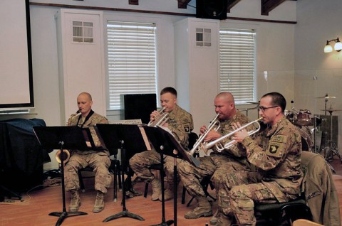 The 101st Airborne Division (Air Assault) Band plays the national anthem during the Dr. Martin Luther King Jr. observance day, hosted by the 101st Airborne Division (Air Assault), Jan. 20, 2014, at Bagram Air Field, Parwan province, Afghanistan. (U.S. Army photo by Sgt. Sinthia Rosario, Task Force Lifeliner Public Affairs)